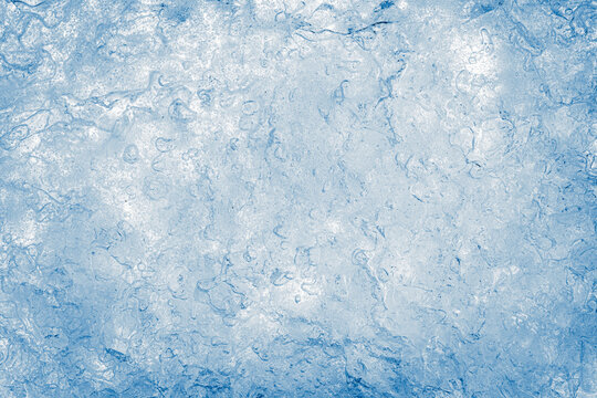 Ice texture background. The textured cold frosty surface of crushed ice.
