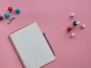 Chemical molecular models in representation of methanol with notebook.