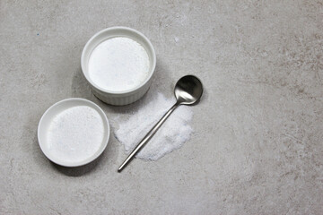 Collagen powder on grey beton background. Natural health supplement for skin