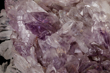 Macro of amethyst mineral stone on black background