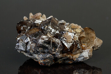 macro mineral cassiterite stone on gray background