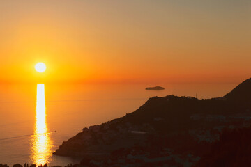 beautiful sunset on the calm sea surface as a natural background