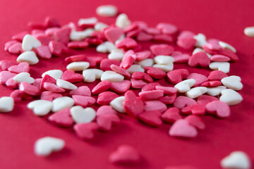 Obraz na płótnie Canvas Heart shape candy for Valentine's day on a red background