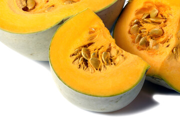 large slices of pumpkin in close - up , on a white background