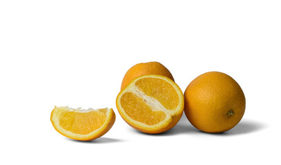 several oranges, whole and slices on a white background, close-up, isolate