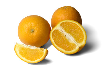 two whole oranges and orange slices on a white background, close-up, isolate