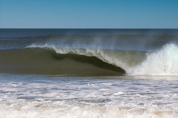 Ocean wave breaking on the beach