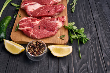 meat vegetables ingredients on a wooden board beef