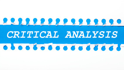 On a gray background, a white calculator, a pen, banknotes and a sheet of paper under a black paper clip with the text LINE OF CREDIT. Business concept