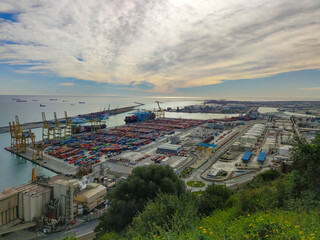 Mediterranean and european city Barcelona and a view over the Harbor with lots of cargo. Industrial
