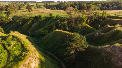 Landscape panorama: mountains, lake, valley, trees and footpath.