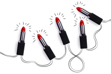 Creative concept fashion holiday photo of cosmetics beauty products lipstick in the shape of...