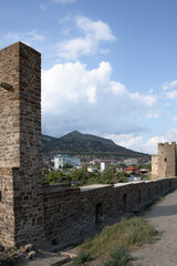 Obraz premium The Genoese fortress is a ancient fortress in the city of Sudak on the Crimean peninsula, built by the Genoese as a stronghold on the Black Sea. Tourism concept, travel, landmarks.