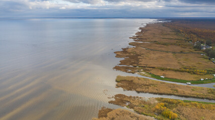 Aerial view to the autumn colored  shallow and sandy  coastal zone of the Lake Peipsi, in Varnja, Estonia. It is the 4th largest lake in Europe