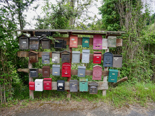 Liguria, Italy, 7.06.2021. Colorful letterboxes in rural Liguria.