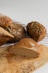 Bakery bread with seeds on the table. Fresh pastries for breakfast.
