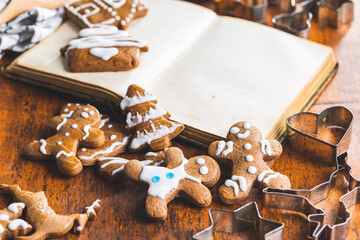 Homemade sweet christmas gingerbread cookies and cookbook.