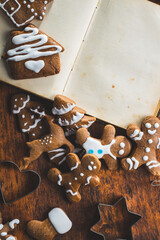 Homemade sweet christmas gingerbread cookies and cookbook.
