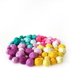 Fototapeta na wymiar White background. Colored thread, balls of yarn.