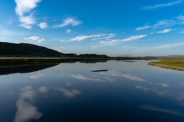 Beautiful Landscape of a lake with the reflection of the sky with a sunset in ICELAND 
