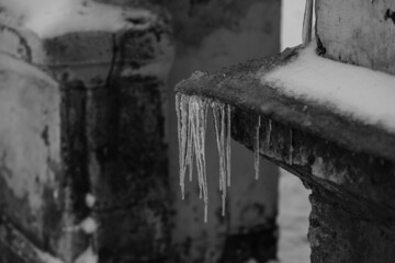 Icicles hanging from the roof.