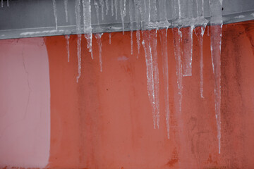 Icicles hanging from the roof.