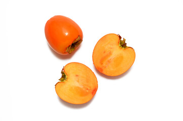 whole fruit and persimmon in a cut isolated on white background