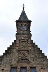 Fototapeta na wymiar Cupola & Broken Clock on Tower of Old Victorian Derelict Stone Industrial Building 
