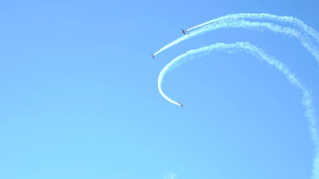 planes doing tricks in the blue sky