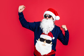 Fototapeta na wymiar happy bearded man in santa claus costume celebrate winter holiday of chistmas and feel merry about xmas gifts, new year corporate party