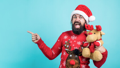 santa claus bearded man hold toy wish happy new year and merry christmas holiday ready to celebrate...