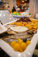 fish slicing and various dishes on the buffet in the restaurant