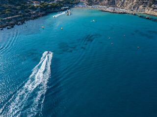 Aerial view on jet ski in azure water of a sea