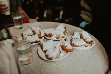 Beignets covered in powdered sugar at a cafe in New Orleans