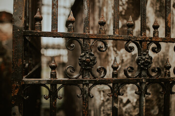 Up close, aged iron work around a tomb in New Orleans