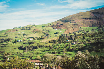 Obraz premium Cantabrian hills and rural landscape of farmland. Valleys pasiegos in nothern Spain. Toned.