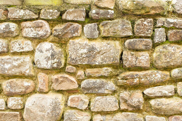 Old rock wall textured background, close up.