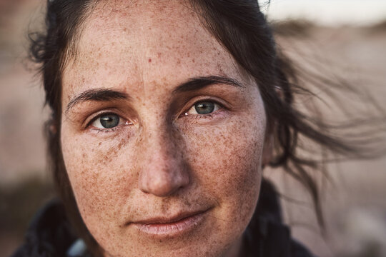 Portrait of female with freckles in the desert