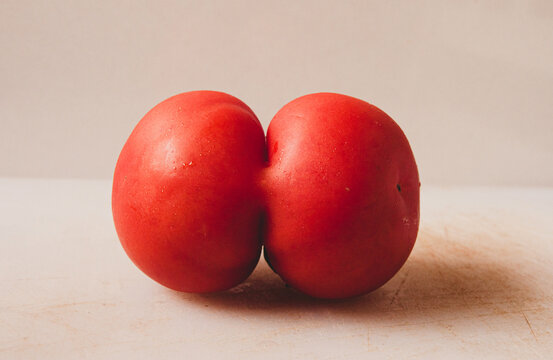 two tomatoes united in one