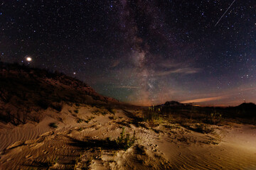Fototapeta na wymiar The sandy desert landscape at starry night