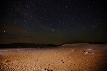 Fototapeta The sandy desert landscape at starry night obraz
