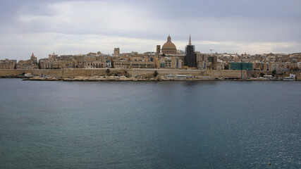 Fototapeta na wymiar Port of Valletta with the St. Pauls Cathedral in a background