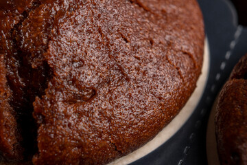 Textured chocolate muffin. Sweet Christmas dessert. Macro