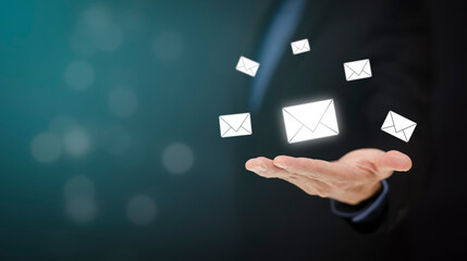 Businessman hand holding e-mail icon letter on a touch screen interface, virtual postal envelope, concept of spam email, internet and networking, Contact us newsletter email and protect your personal.