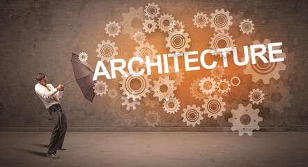 Obraz premium Businessman defending with umbrella concept