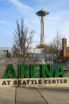 Seattle - November 21, 2021; The Historic Space Needle, An Icon Of Seattle Rises Behind The Sign For The Redeveloped Climate Pledge Arena At The Seattle Center Complex