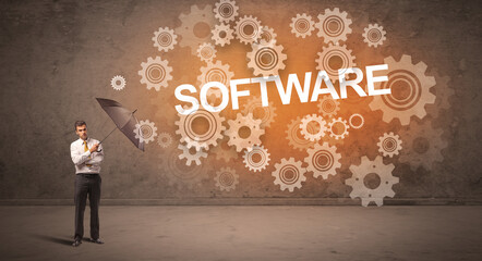 Businessman defending with umbrella concept