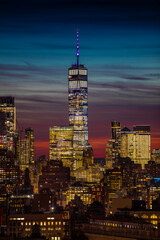 Naklejka na ściany i meble Sunset over Lower Manhattan and the Freedom tower