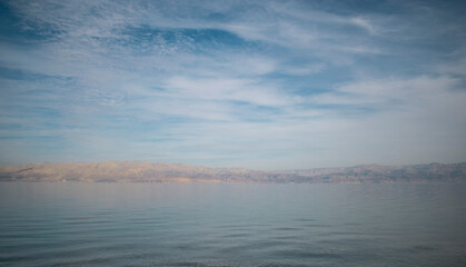 Naklejka na ściany i meble Dead sea blue sky landscape with sandy dunes