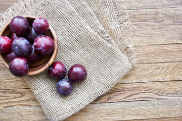 plums fruits natural products on a wooden table top view